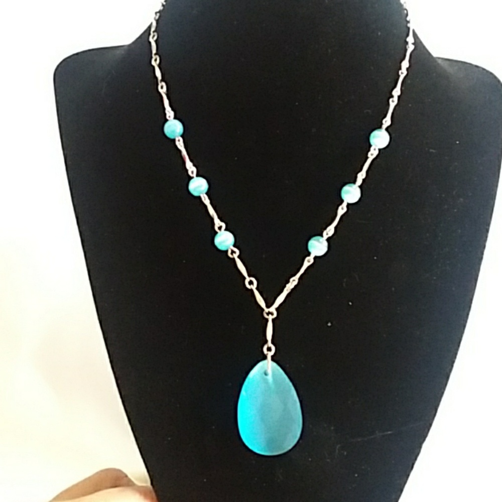 Silvertone necklace with blue glass pendant